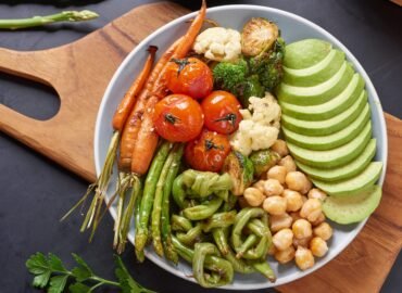 Vegetarian Buddha bowl with fresh vegetable salad and chickpea. Vegetarian and vegan food concept. Healthy eating.