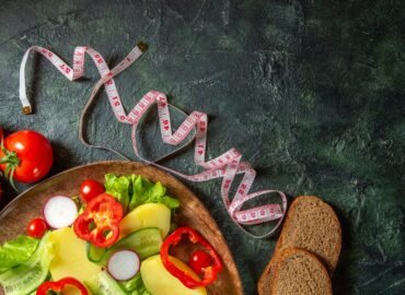 half-shot-fresh-peeled-cut-potatoes-with-red-pepper-radishes-green-tomatoes-brown-plate-meters-spices-bread-slices-green-black-mix-colors-surface